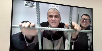 Three Jehovah&rsquo;s Witnesses during an appeal hearing in the Rostov Regional Court. In the center of Vilen Avanesov. December 6, 2021