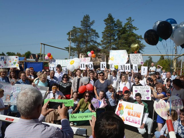 Family and friends of the Beltikovs meeting Maksim