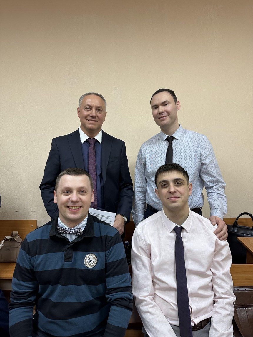 Defendants in the courtroom during a break